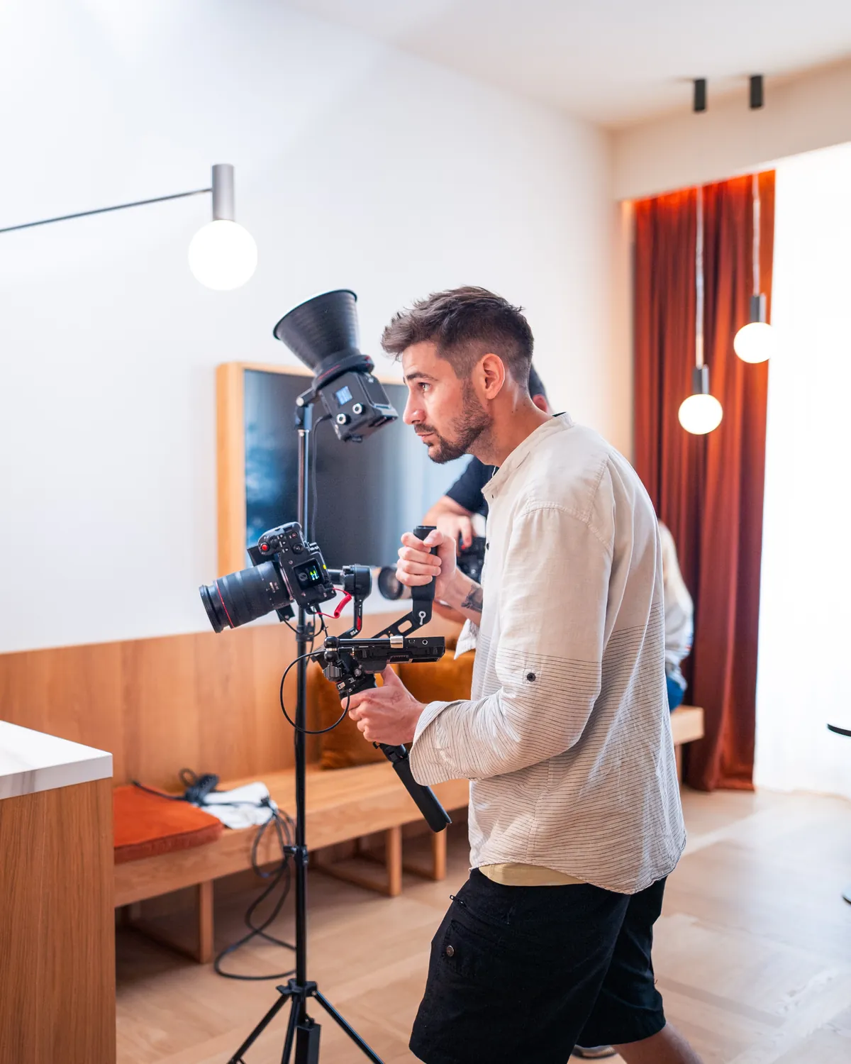 Tomáš Berka with a camera on a gimbal, directing a shot on the Fua Fua set